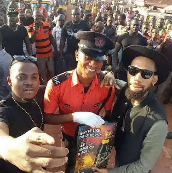 Olamide And Phyno Pay A Surprise Visit To A Traffic Warder In Enugu [See Photo]